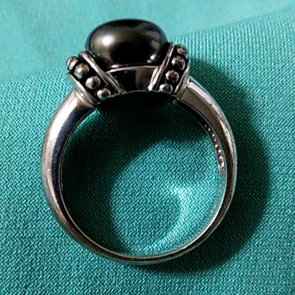 Black pearl ring.